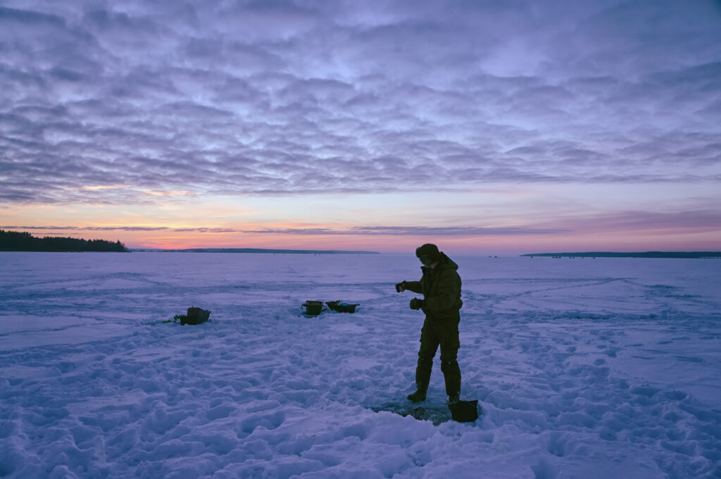 Ice fishing at night.