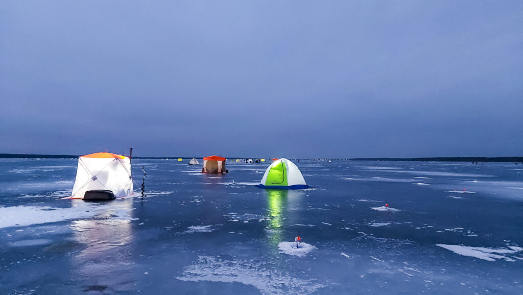 Ice fishing at night in tents