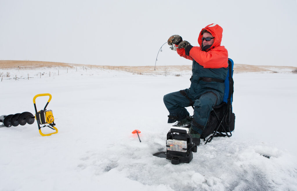 Ice fisherman using a spinning reel.